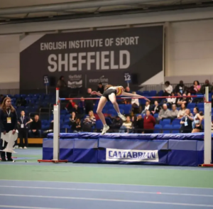 Martha jumping a PB of 1.65m at the England Athletics Indoor Championships